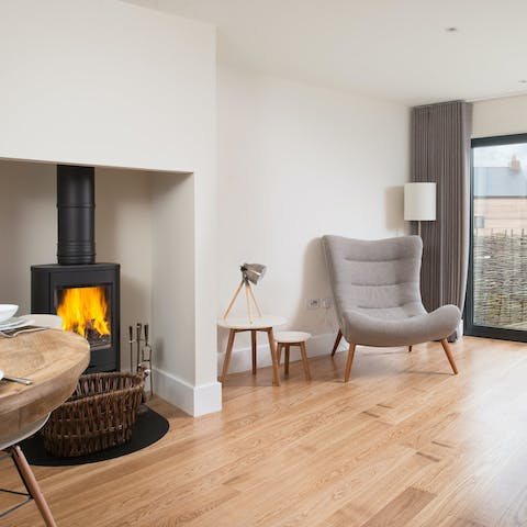 Cosy up inside around the wood-burning fireplace on chilly evenings