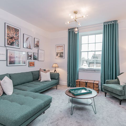 Kick back on the tufted corner sofa in the light-filled living space