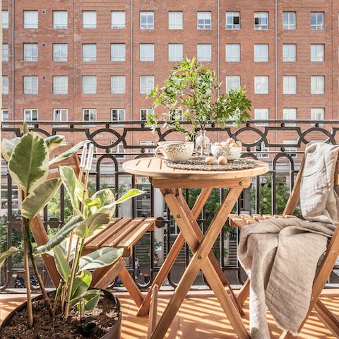 Enjoy a glass of Spanish wine out the sunny balcony