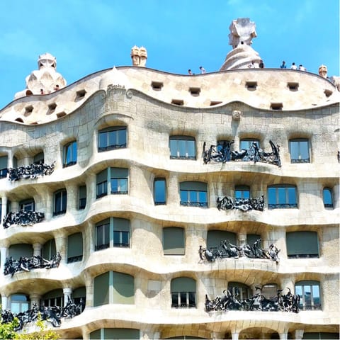 Stroll twelve minutes to visit one of your street neighbours, Casa Milà