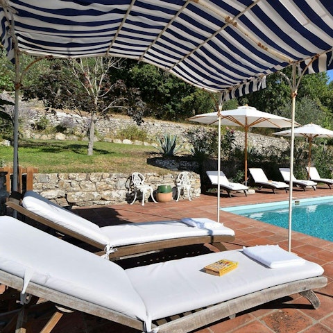 Experience total relaxation while lounging by the pool