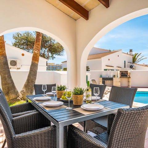 Tuck into an alfresco lunch overlooking the pool