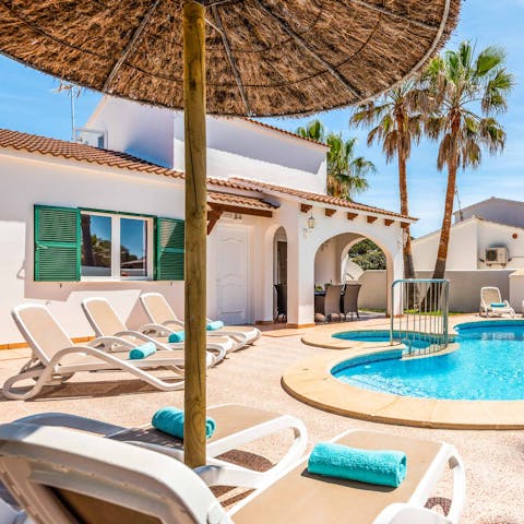 Relax by the pool in the sun or shade