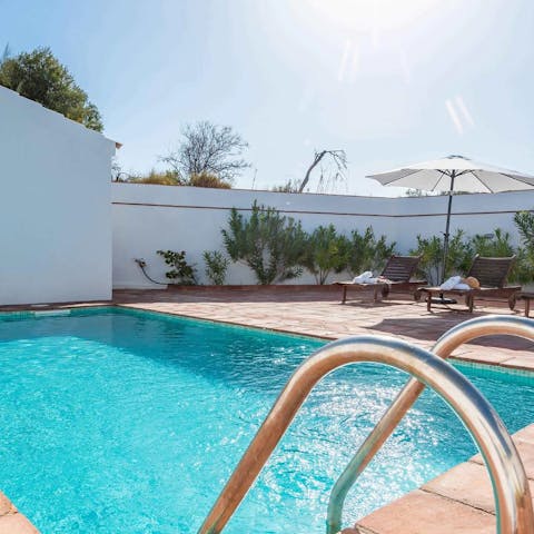 Feel refreshed after a dip in the private swimming pool