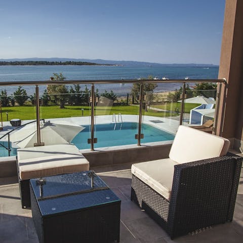 Take in scenic views of the Aegean Sea from the balcony