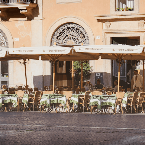 Savour the magic of Rome while sipping drinks in a restaurant