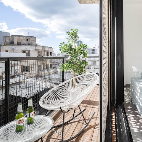 Relax and unwind on the private balcony, cool drink in hand