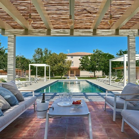 Go for a dip in the private pool or chill under the pergola