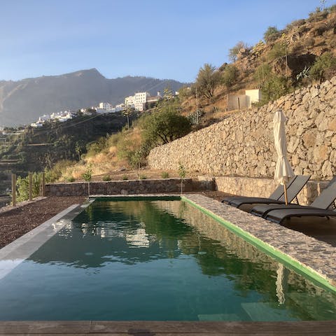 Watch the sunset from the shared infinity pool