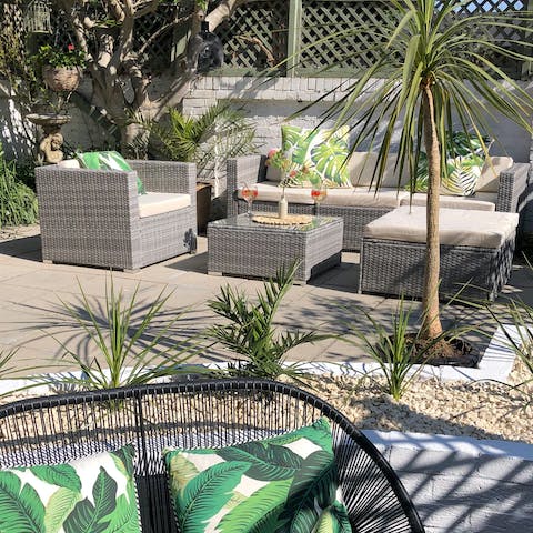Sit back with a glass of craft beer in your luscious garden