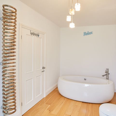 Sink into the deep tub for a warming soak after a day of exploring