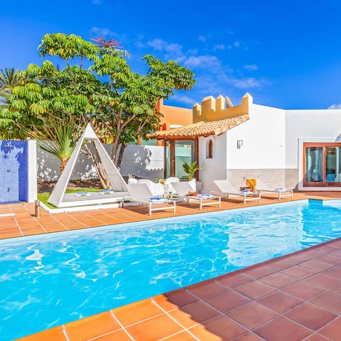 Stretch out in the sun in between dips in the pool