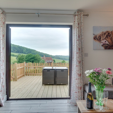 Open up the glass doors in the living room and let the country air flow through