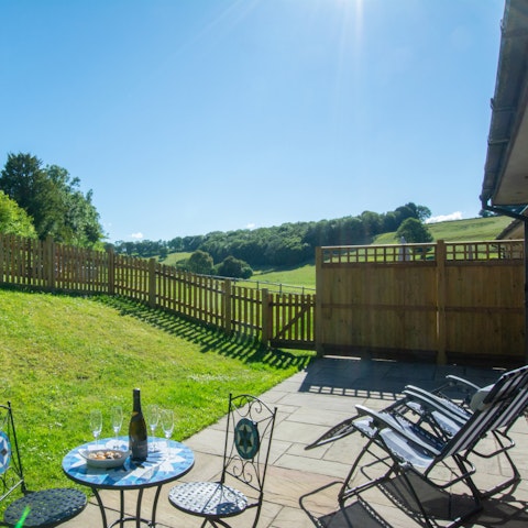 Sit in the sunshine on the patio out back, cold drink in hand