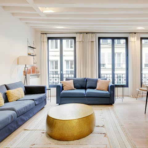 Enjoy a glass of Champagne in the bright living room