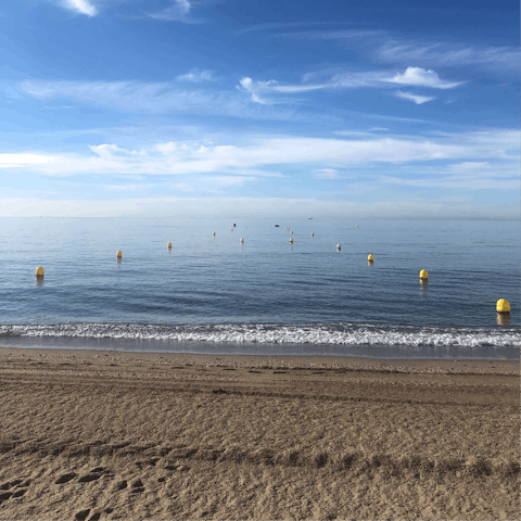 Stroll 500 metres to sink your feet into the sand at La Cala beach