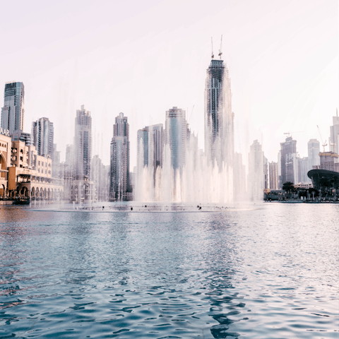 Walk to the Dubai Fountain, soaking up the spectacular show