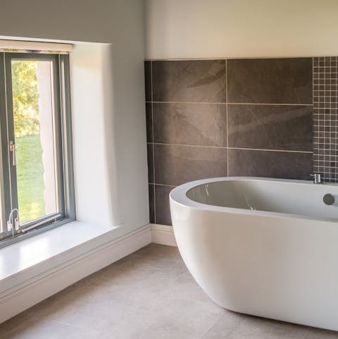 Enjoy the country views as you soak in the sleek bathtub