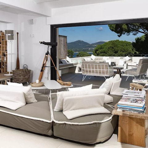 Explore the stars from the comfy lounge area and its telescope