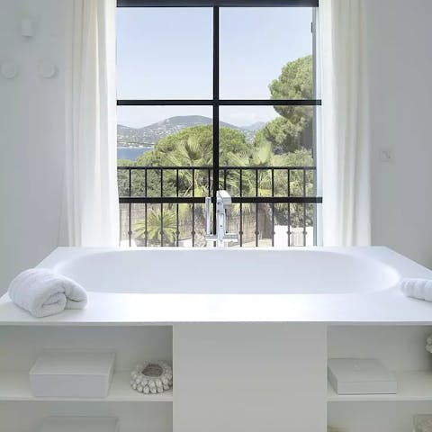 Sink into the hot waters of a luxurious bath in the main en-suite