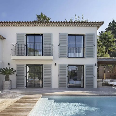 Soak up the sun by the calm waters of the private pool