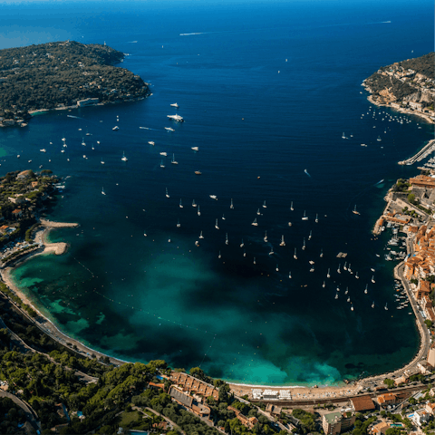 Swim in the azure waters of the Bay of Villefranche-sur-Mer