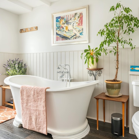 Soak in the freestanding bath after a long day at the beach