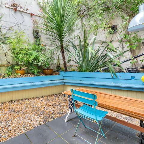 Have an afternoon drink with a charcuterie board at the courtyard table