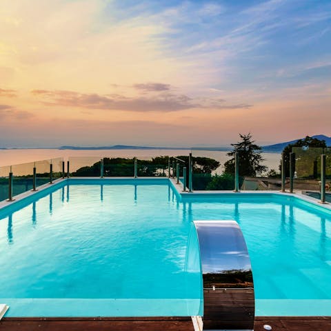 Watch the sunset over the Mediterranean Sea from the private pool
