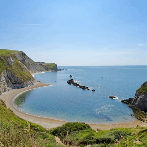 Take a scenic 15-mile drive down to Lulworth Cove