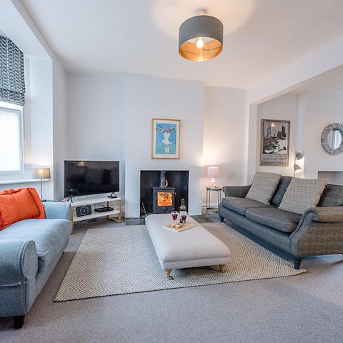Enjoy cosy gatherings around the fire in the living room