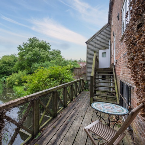 Stay in a gorgeous converted mill, with views across the stream
