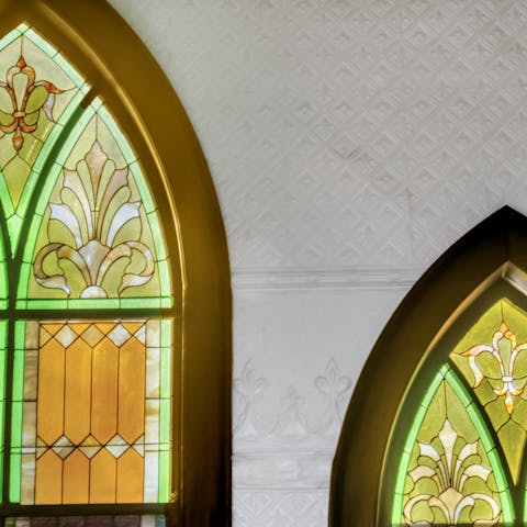 Bask in the glow of sunlight streaming through stained-glass windows