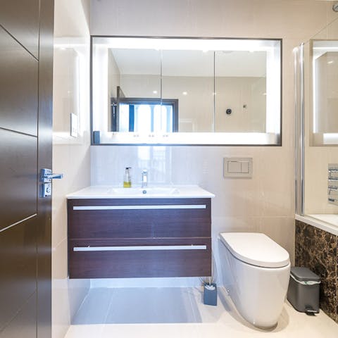 Freshen up in the luxurious en-suite bathroom