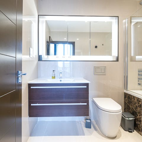 Freshen up in the luxurious en-suite bathroom