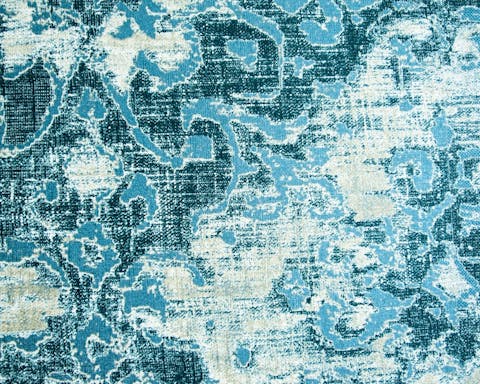 The textured wallpaper in the bedroom