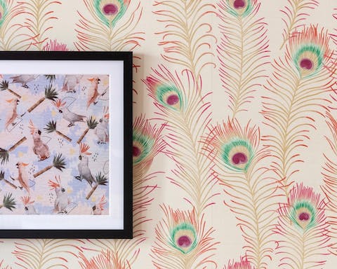 The peacock feather-themed wallpaper