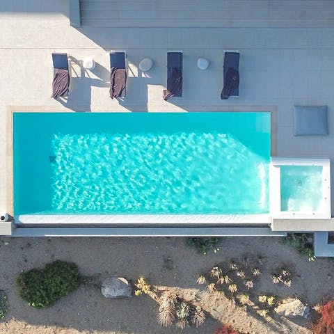 Swim, splash and sunbathe at the private infinity pool