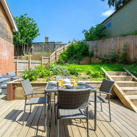 Enjoy breakfast on the sun-trap deck in the garden