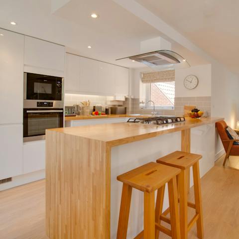 Prepare your meals in the smart, modern kitchen – open-plan to keep it sociable