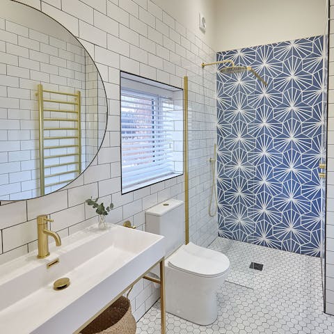 Wash away the sandy day beneath the luxurious rainfall shower