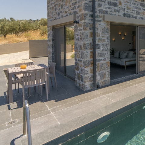 Dine alfresco with rolling olive orchards views
