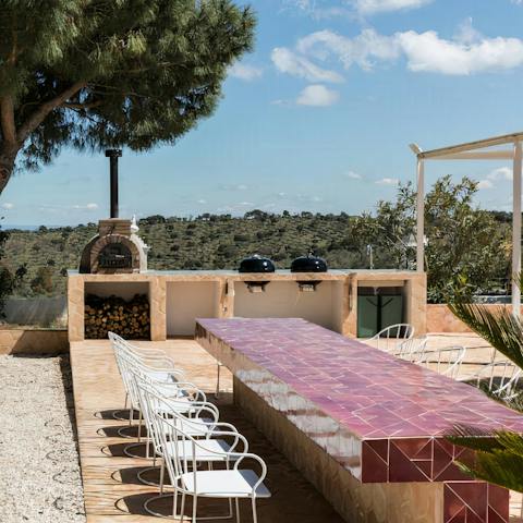 Dig into smokey seafood paella hot off the barbecue