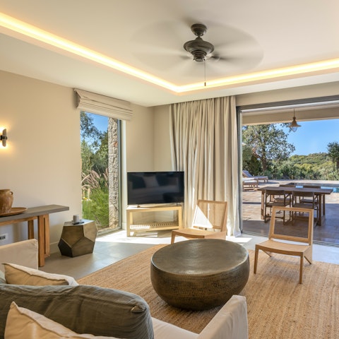 Relax in the living room with the doors swung open