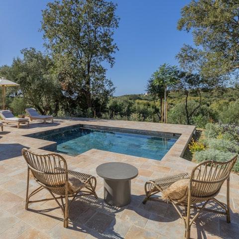 Soak up the sunshine by the swimming pool