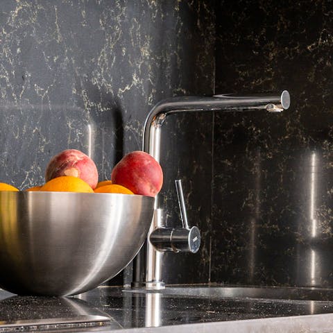 The black granite kitchen surfaces