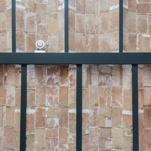 Admire striking, original features such as the vaulted, exposed brick ceilings