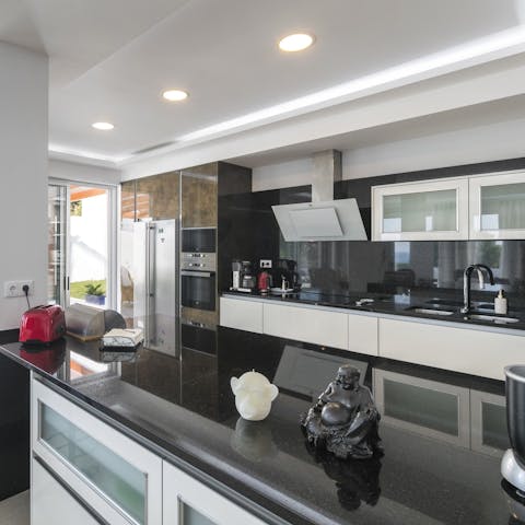 Let the chef of the group loose in the sleek, monochrome kitchen