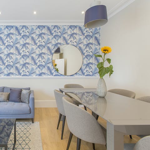 Gather together for celebratory meals in the tropical-vibe living area