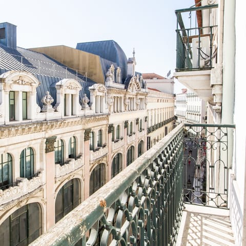 Look out from the balcony on the lively street below